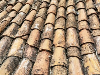 Roof tile. Red tile. Old building tile.
