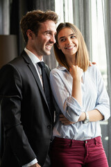 Happy satisfied couple looking and planning their future, vision