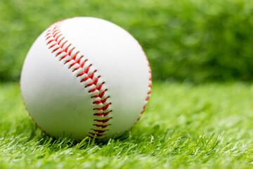 Baseball is on green grass