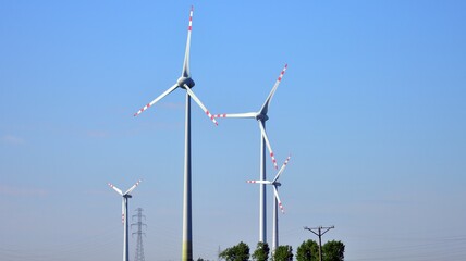 Wind mills during bright summer day