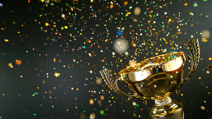 Champion golden trophy isolated on black background. Concept of success and achievement. Gold glitters explosion.