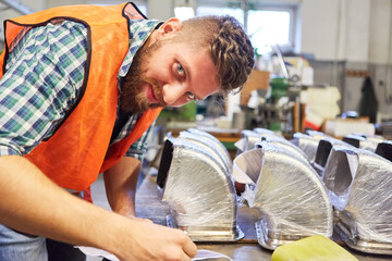 Metal worker apprentice or warehouse clerk with products