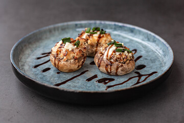 Stuffed mushroom caps with cream cheese, breadcrumbs and parmesan