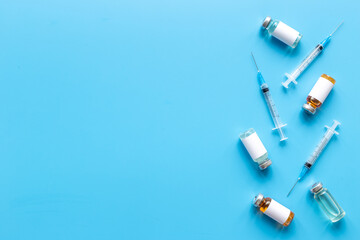 Medicine bottle for injection. Coronavirus vaccine ampoules with syringe