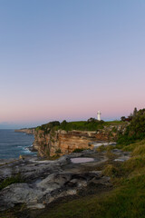 Fototapeta na wymiar Sunrise view of Macquarie Lighthouse by the ocean, Sydney, Australia.