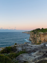 Fototapeta na wymiar Sunrise view by the ocean cliff.