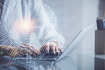 Double exposure of woman hands working on computer and brain hologram drawing. Ai concept.