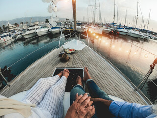 Senior couple having romance holidays on sailboat during summer vacation - Main focus on hands