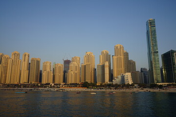 Obraz na płótnie Canvas Sunset view on buildings in Dubai Marina