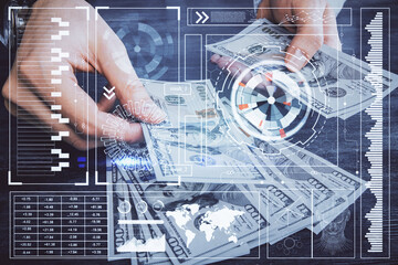 Multi exposure of technology drawing hologram and us dollars bills and man hands. Data concept