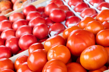 Ripe tomatoes on the counter in a grocery store. High quality photo