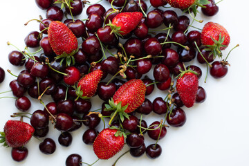 Fototapeta na wymiar Cherries with strawberry