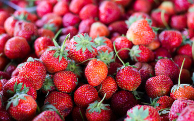Ripe strawberries on the counter in a grocery store. High quality photo