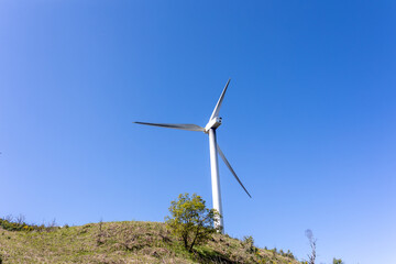 Fototapeta na wymiar Windmills wind energy in the mountain