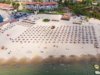 Aerial photography, drone view of sunbeds on the beach in Sveti Vlas. Panoramic view of resort in Sveti Vlas in Bulgaria. Summer holiday in Europe.