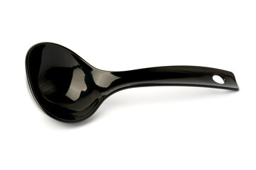 black plastic ladle from a multicooker isolated on a white background.
