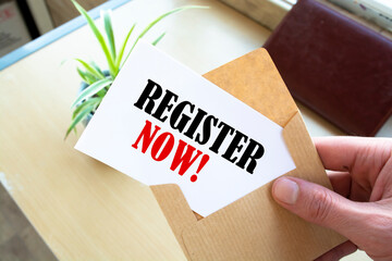 Register Now Concepts - Hand holding a envelope and post card