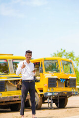 Young indian businessman with his freight forward lorry or truck
