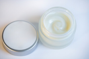 Cream in a jar on a white background