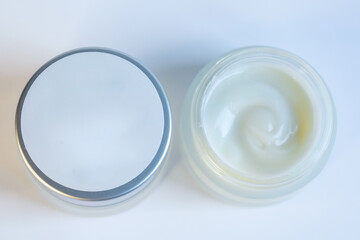 Cream in a jar on a white background