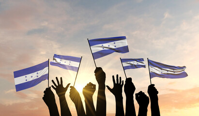 Silhouette of arms raised waving a Honduras flag with pride. 3D Rendering