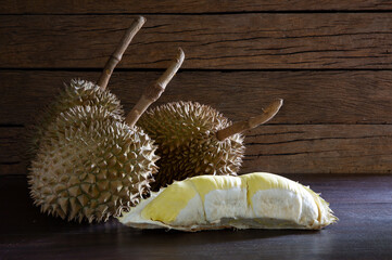 Durian and durian pulp, Thai fruit, put on old wooden table and old wooden wall