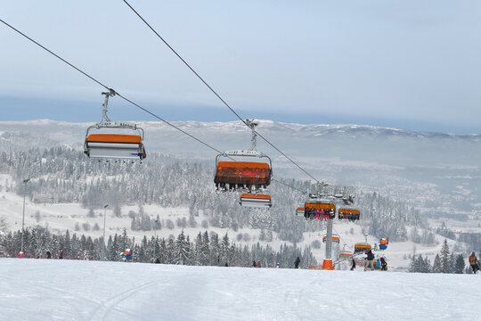 Ski lift and the ski slope in popular winter resort Kotelnica Bialczanska.
