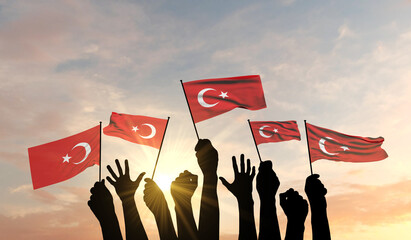 Silhouette of arms raised waving a Turjey flag with pride. 3D Rendering