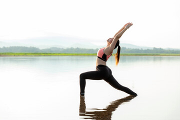 Fototapeta na wymiar Yoga women lifestyle exercise and pose for healthy life. Young girl or people pose balance body vital zen and meditation for workout sunrise morning reflection on the water nature background