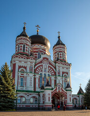 Fototapeta na wymiar Panteleimon Monastery in Feofania, Kyiv. Beautiful old red orthodox church. Crosses on the domes. Cathedral Area. The Feofaniya Park is one of the most beautiful places in Kiev, Ukraine