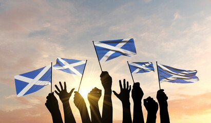 Silhouette of arms raised waving a Scotland flag with pride. 3D Rendering - obrazy, fototapety, plakaty