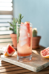 Classic Paloma cocktail on cutting board