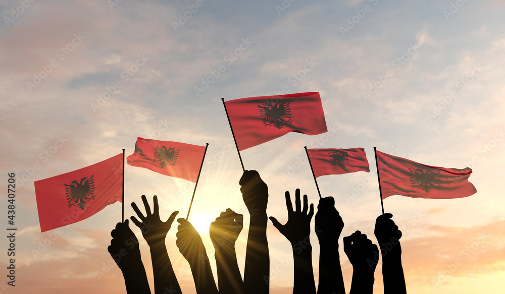 Wall mural silhouette of arms raised waving a albania flag with pride. 3d rendering