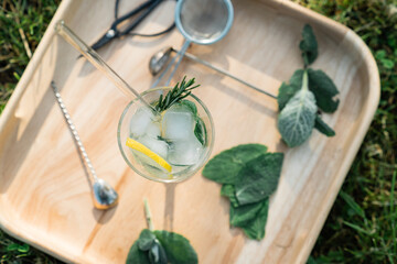 Top view of iced summer lemonade with tonic, lime, mint