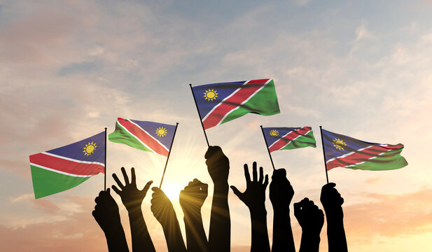 Silhouette of arms raised waving a Namibia flag with pride. 3D Rendering