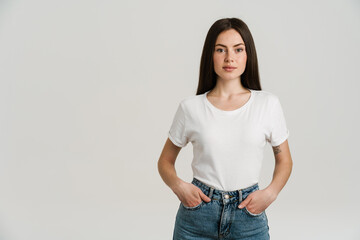 Young brunette woman posing and looking at camera