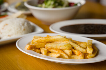 fresh and hot french fries on plate