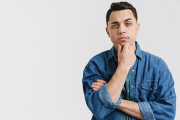 Young brunette white man posing and looking at camera