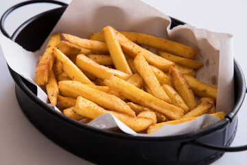 fresh and hot french fries on plate