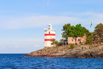 Fototapeta na wymiar Lighthouse on Djurö nationalpark. a rocky island in Lake Vänern in Sweden