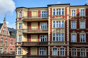 fragment of the facade of historic tenement houses