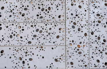 texture of holes in facade