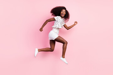 Full size profile side photo of young happy excited afro girl running in air fast speed isolated on blue color background