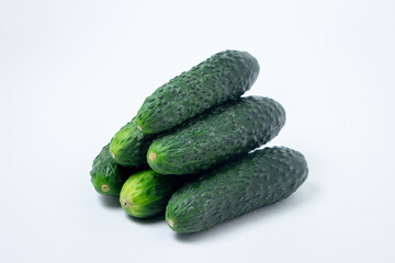 Cucumbers on a white background. Fresh ripe cucumbers.