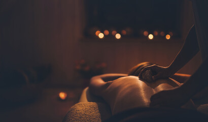 massage of a beautiful woman, body care.