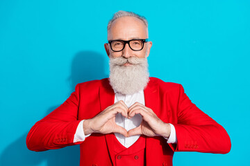 Photo portrait elder man in spectacles showing heart shaped gesture isolated vivid blue color...