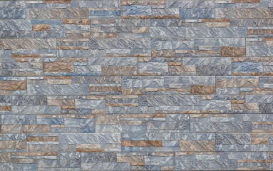 Old wall of thin sandstone slabs, layered masonry