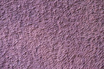 Texture of old wall with decorative plaster dark purple colors. .