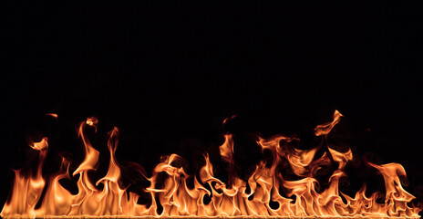 Fire flames on black background, close-up