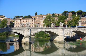 Fototapeta na wymiar Bridge over the Tiber river. Italian architecture